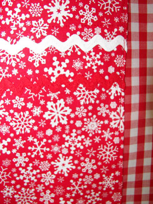 Close up of snowflake and red gingham
