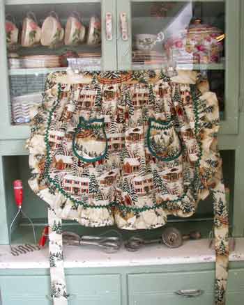 1948 Ruffle Half Apron Old Time Village Christmas, click for other 1948 ruffle half aprons